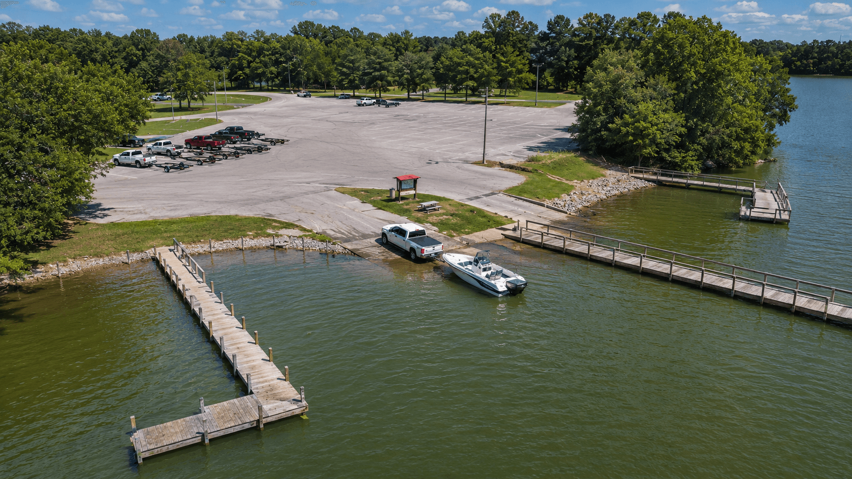 Aerial view of a boat ramp and parking lot